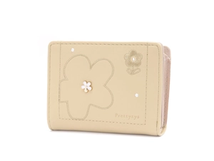 Detailed view of floral embroidery and metallic flower on beige trifold leather wallet