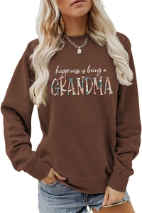 Detail of floral texture inside grandma text on a brown long sleeve sweatshirt
