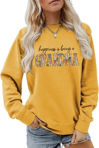 Detail of floral-filled Grandma text on ginger yellow crewneck sweatshirt