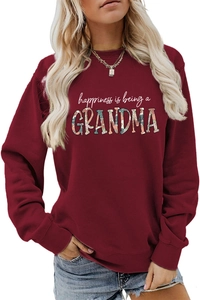 Detail of floral texture inside the Grandma text on a burgundy sweatshirt
