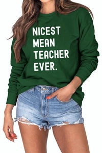 Detail of dark green sweatshirt featuring white Nicest Mean Teacher Ever text design