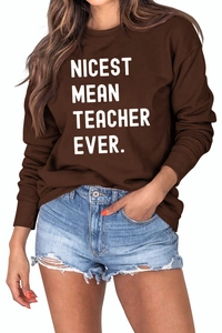 Close-up of ribbed cuffs and white bold text print on brown crewneck sweatshirt