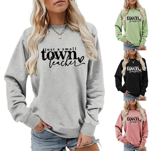 Détail de l'imprimé just a small town teacher sur des sweat-shirts de diverses couleurs