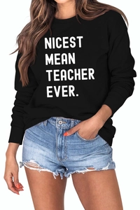 Detail of NICEST MEAN TEACHER EVER slogan printed on black cotton crewneck sweatshirt