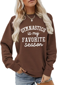 Close-up of brown long sleeve sweatshirt with Gymnastics is my Favorite Season print