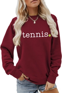 Detailed close-up of a burgundy tennis sweatshirt showing fabric texture and ribbed cuffs