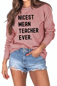 Detail of dusty rose sweatshirt with black NICEST MEAN TEACHER EVER print and ribbed cuffs