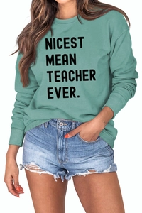 Detail of mint green sweatshirt with Nicest Mean Teacher Ever print and ribbed cuffs