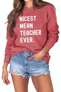 Detail of Nicest Mean Teacher Ever print on retro red crewneck long sleeve sweatshirt