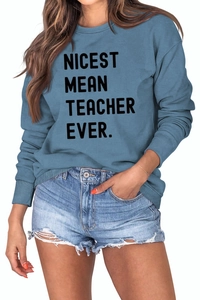 Close-up of fog blue sweatshirt with Nicest Mean Teacher Ever print and ribbed cuffs