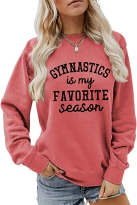 Detail of Gymnastics Is My Favorite Season print on a pink crewneck sweatshirt