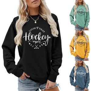 Detail showing various colors of the Livin That Hockey Mom Life crewneck sweatshirt