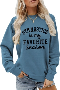 Detail view of the ribbed cuffs and hem on the blue gymnastics printed sweatshirt
