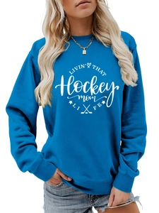 Detail of blue hockey mom sweatshirt featuring white graphic print and ribbed neckline