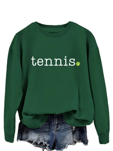 Close-up of tennis print and soft forest green fabric texture on long sleeve sweatshirt