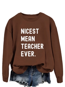Detail of Nicest Mean Teacher Ever slogan print on a brown casual sweatshirt