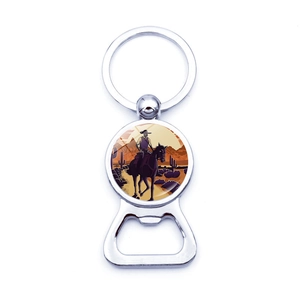 Detail of western cowboy sunset illustration on silver metal bottle opener keychain