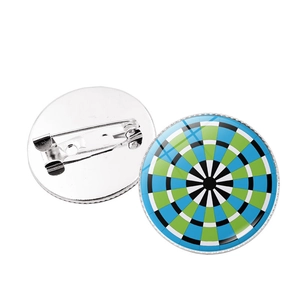 Detail of dartboard pins with colorful geometric patterns and safety pin back fasteners