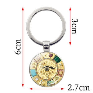 Bohemian gold evil eye keychain with lucky symbols and enamel charms, 6cm total length
