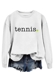 Close-up of white crewneck sweatshirt with black tennis text and green tennis ball print