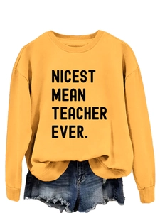 Detail of Nicest Mean Teacher Ever print on yellow long sleeve cotton sweatshirt