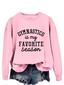 Detail of pink long sleeve sweatshirt with Gymnastics is my Favorite Season print
