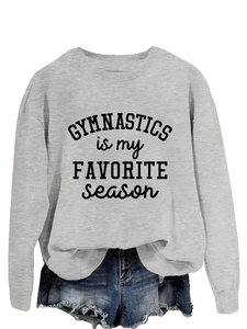 Detail of grey crewneck sweatshirt with 'Gymnastics is my Favorite Season' typography print