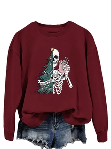 Close-up of Sorta Merry Sorta Scary burgundy sweatshirt with Christmas skull print design