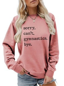Close-up of rib-knit cuffs and hem detail on a dusty pink gymnastics graphic sweatshirt