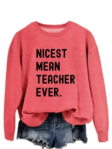 Detail of red crewneck sweatshirt featuring Nicest Mean Teacher Ever print with denim shorts