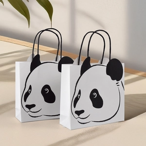 Cute panda cartoon paper gift bags with creative ears and black woven handles for parties