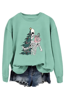 Detail of sorta merry sorta scary print on mint green crewneck sweatshirt with holiday motifs