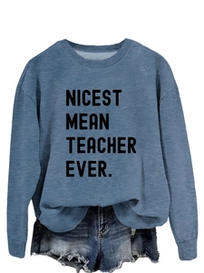 Detailed texture of dusty blue crewneck sweatshirt with printed teacher slogan