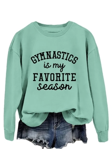 Detail of mint green sweatshirt with Gymnastics is my Favorite Season graphic print