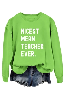 Detail of lime green sweatshirt featuring Nicest Mean Teacher Ever print and soft fabric