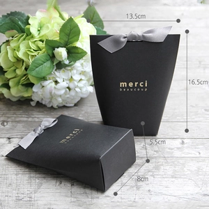 Elegant black paper gift box with grey ribbon and gold lettering for special occasions