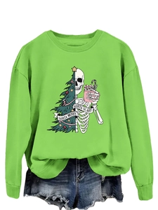 Detail view of the festive sorta merry sorta scary print on a bright green sweatshirt