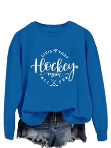 Detail of royal blue hockey mom sweatshirt with white graphic print and ribbed cuffs