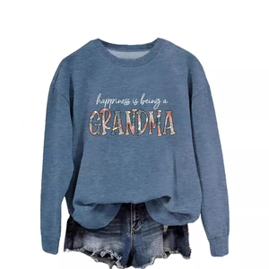 Casual blue long sleeve grandma sweatshirt paired with frayed denim shorts on white background