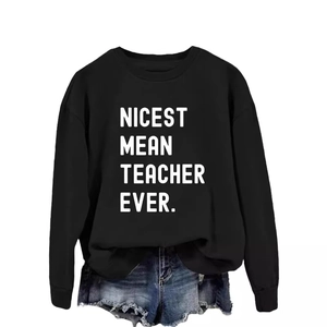 Casual black sweatshirt with Nicest Mean Teacher Ever print and denim shorts