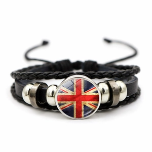 Close-up of retro Union Jack leather bracelet with woven bands and metal beads detail