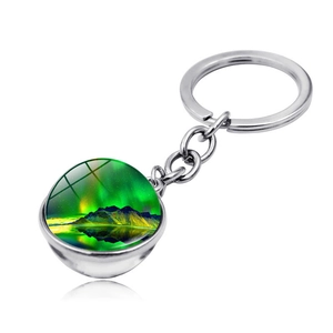 Detailed view of silver keychain featuring a Northern Lights glass sphere pendant