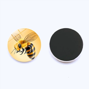 Detailed view showing the crystal glass bee fridge magnet front and magnetic backing