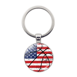 Detail of a round metal keychain featuring American flag and basketball design