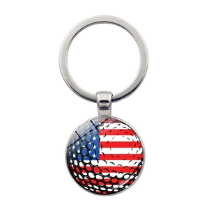 Golf ball texture with American flag pattern on a round silver metal keychain