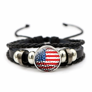 Detail showing the multilayer braided leather band with US flag and golf ball design