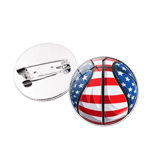 Detailed front and back view of a basketball brooch with US flag star and stripe pattern