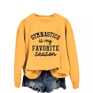 Yellow Gymnastics is my Favorite Season sweatshirt with denim shorts on white background