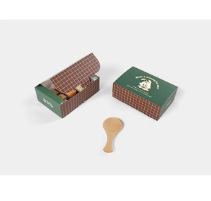 Close-up of cute cartoon rabbit dessert boxes with green and brown checkered patterns