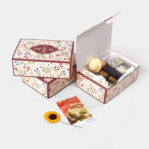Three-piece set of floral gift boxes with All The Best print and decorative sunflowers